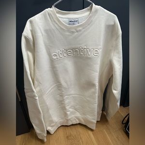 Attentive white sweatshirts
